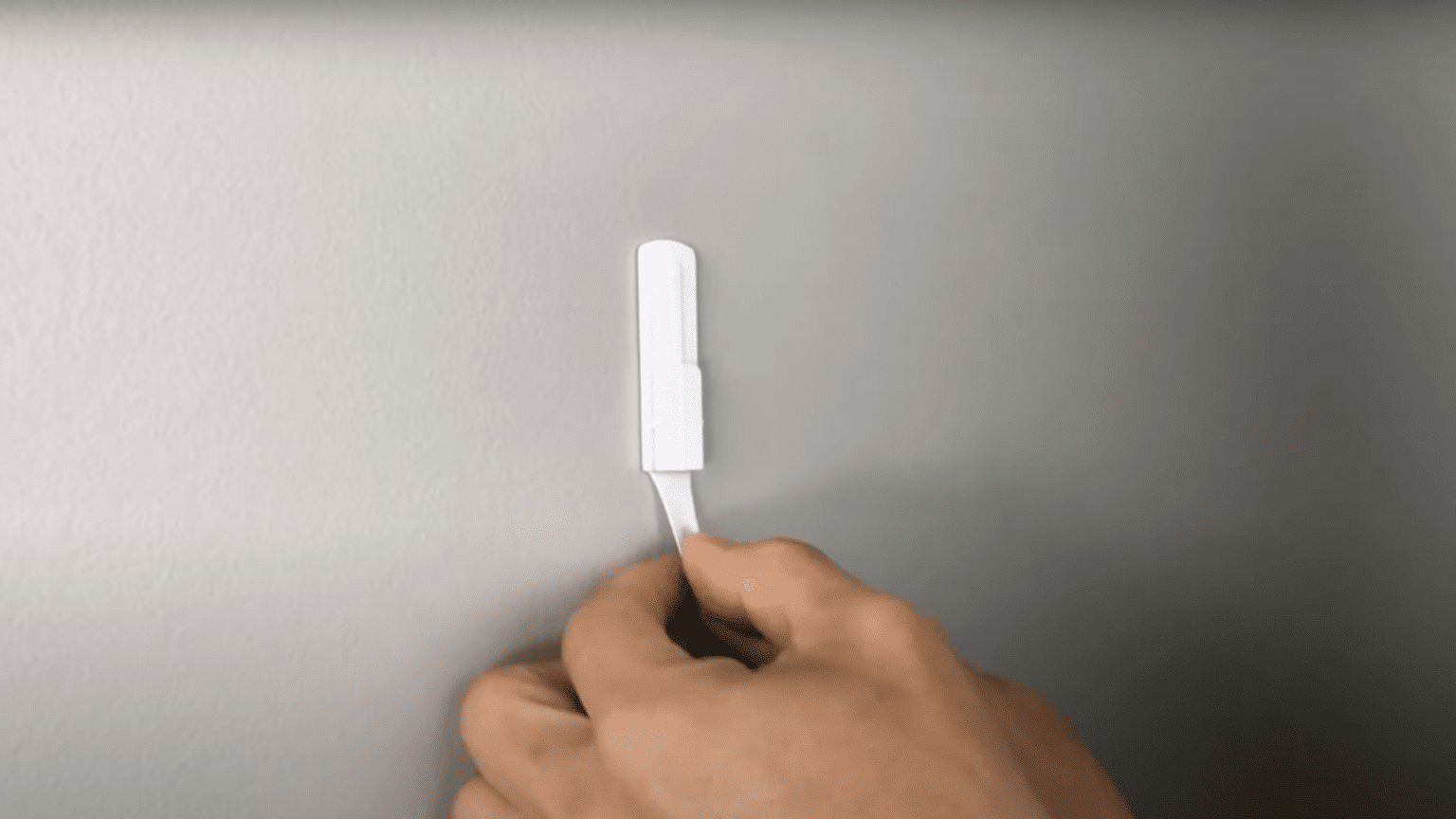 How to Remove Command Strips Without Damaging Your Walls - HelpWithDIY
