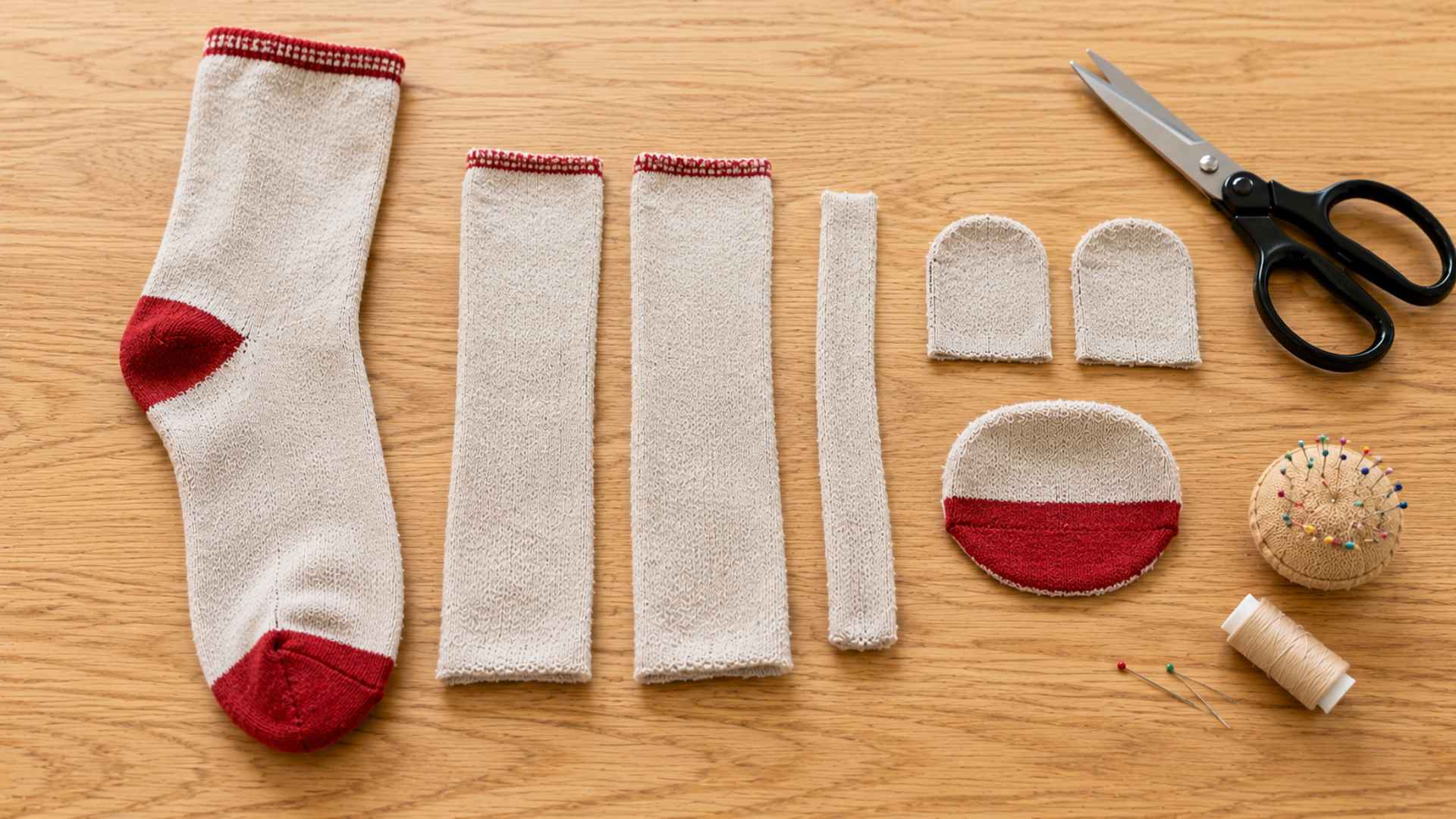 Cutting sock pieces for the arms, tail, ears, and mouth