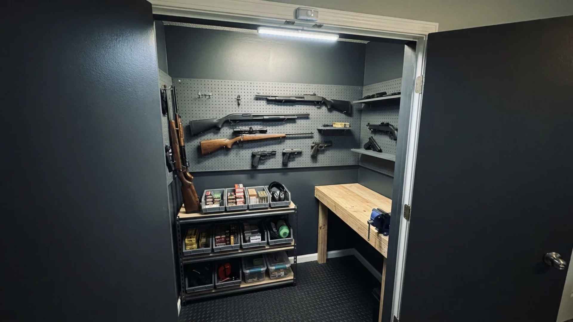 DIY closet gun room with dark interior, pegboard storage, and motion-activated lighting
