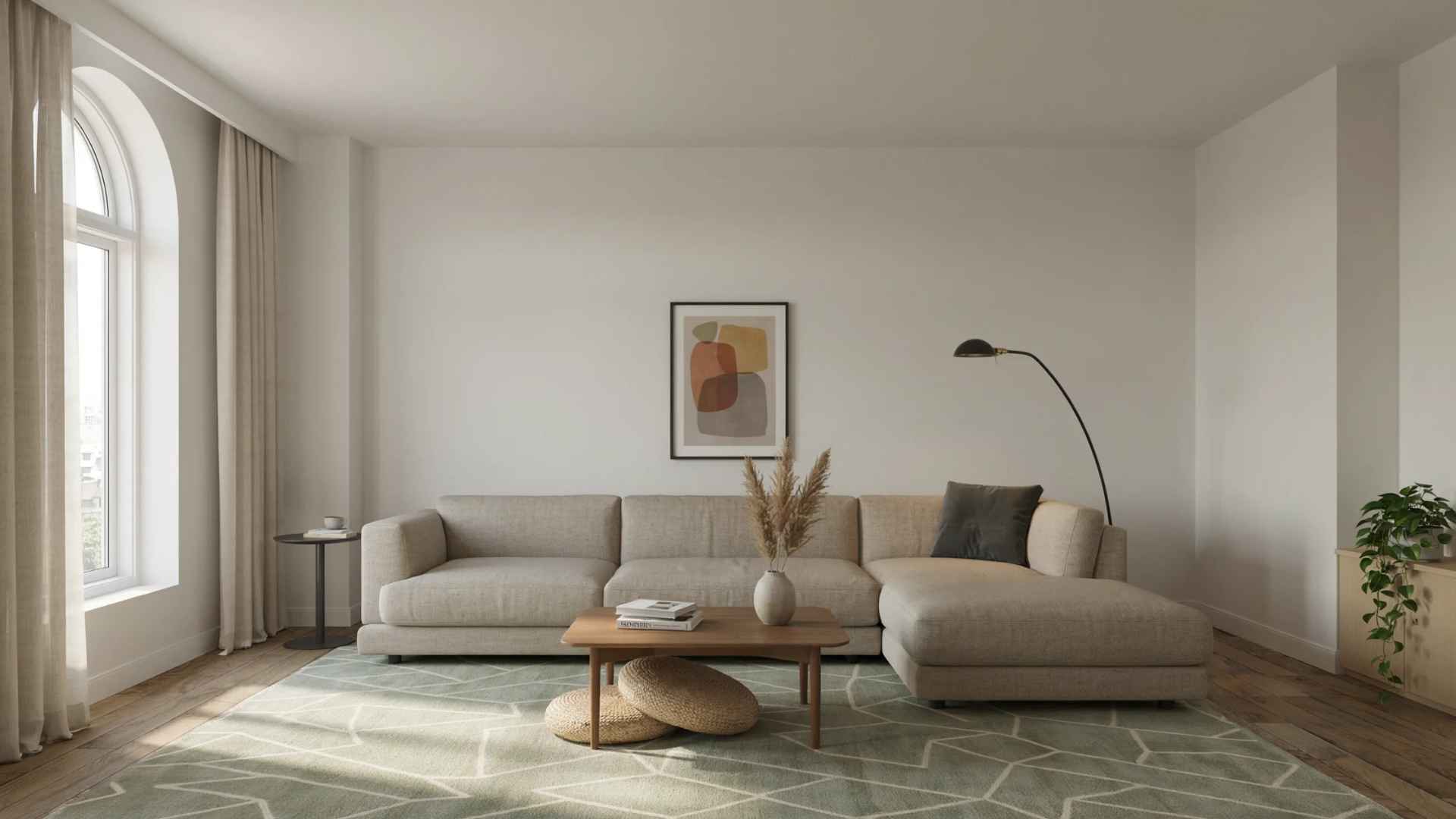 Living room with a large sectional positioned away from the walls and anchored by a rug.