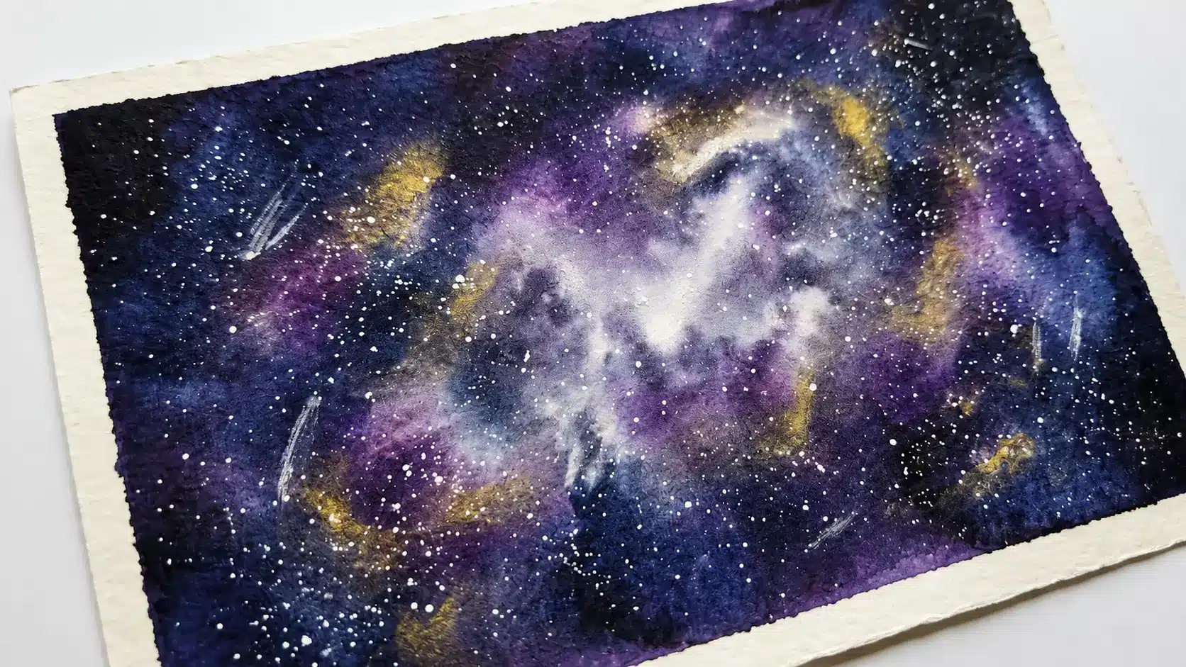Watercolor night sky filled with scattered white stars on deep blue