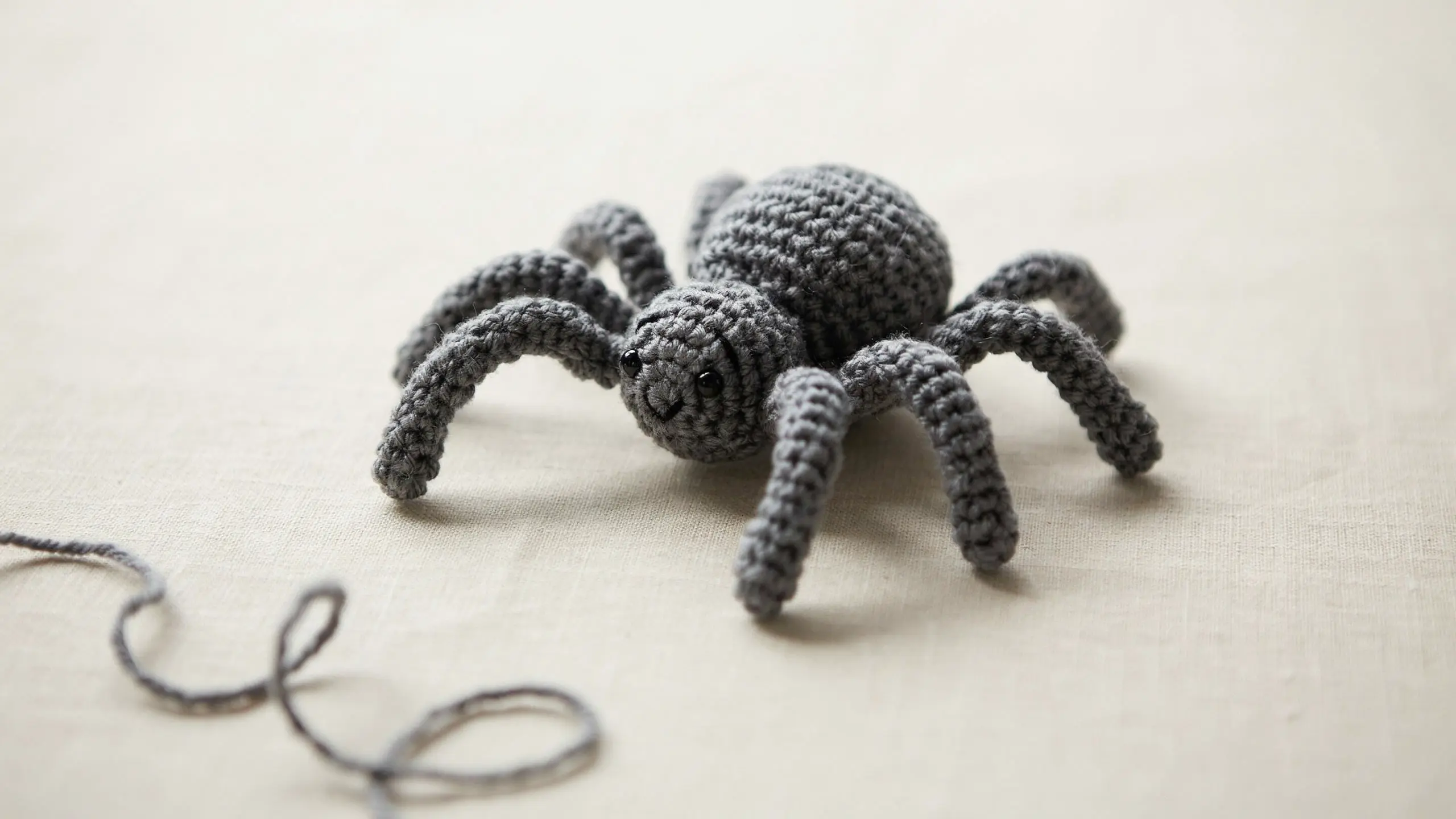Crochet spider with round body and eight legs centered