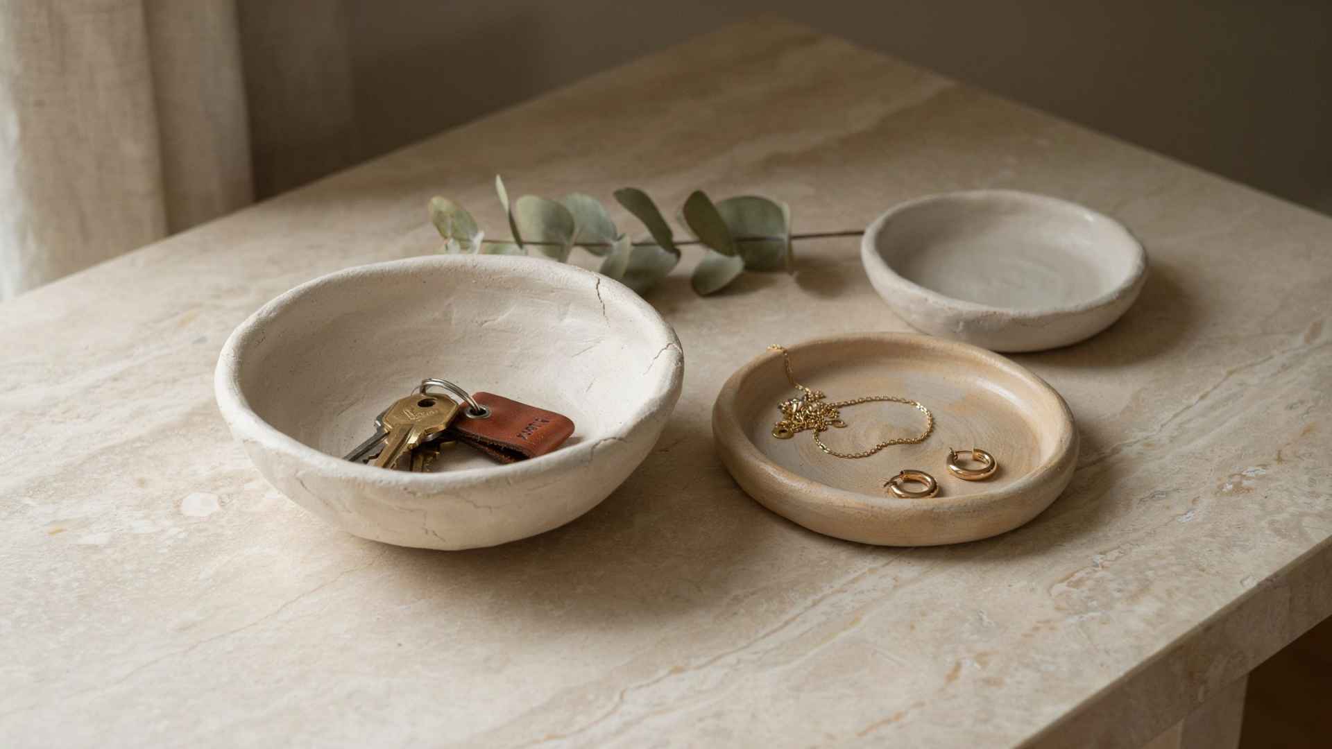 Handmade clay bowls and trays in modern home entry