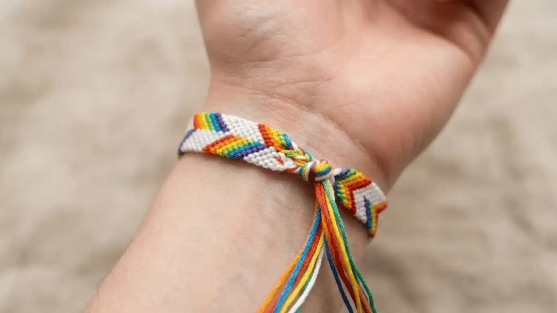Double chevron friendship bracelet with layered V-shaped stripe pattern.