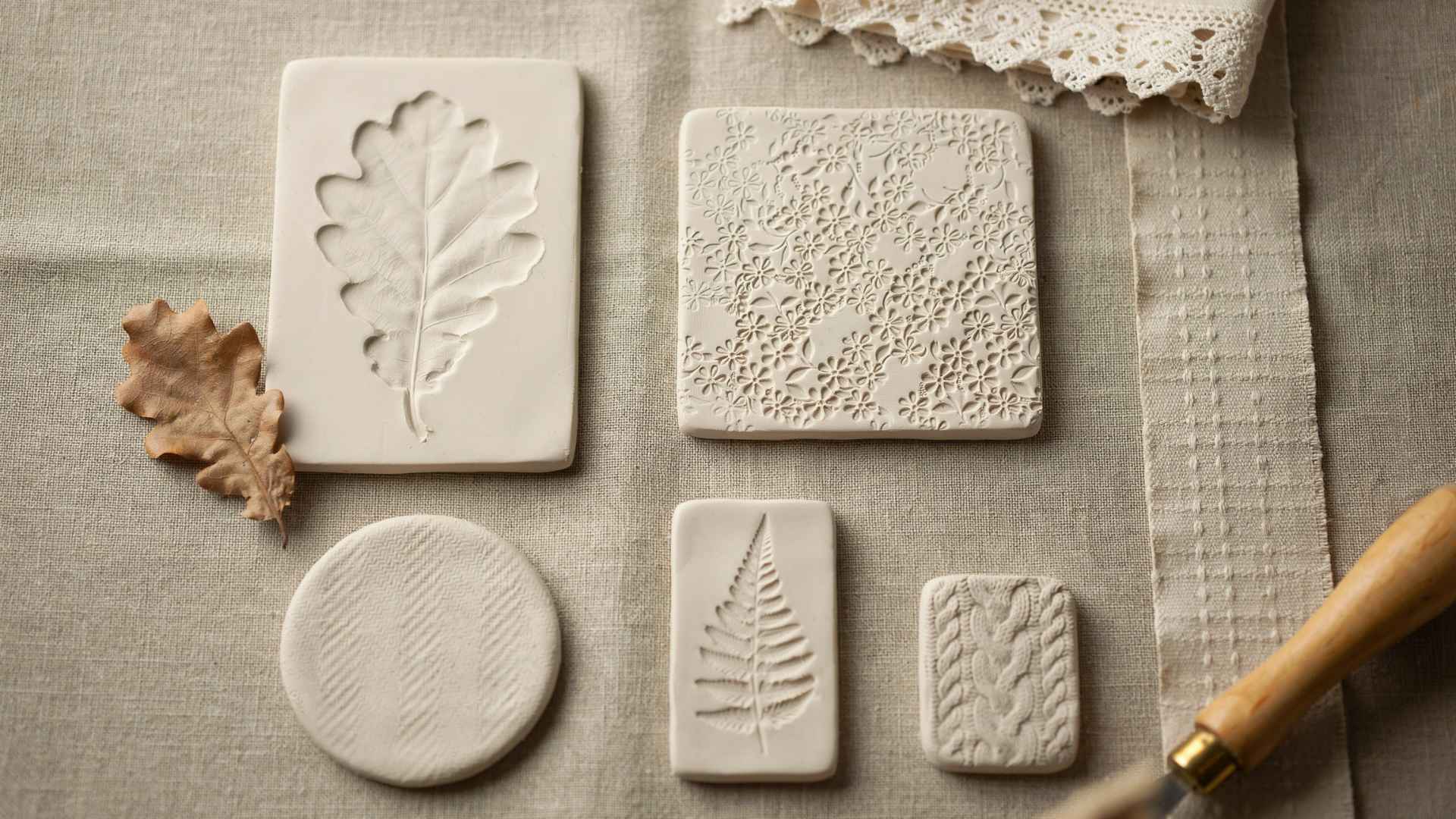 Clay texture stamping with leaf and lace impressions