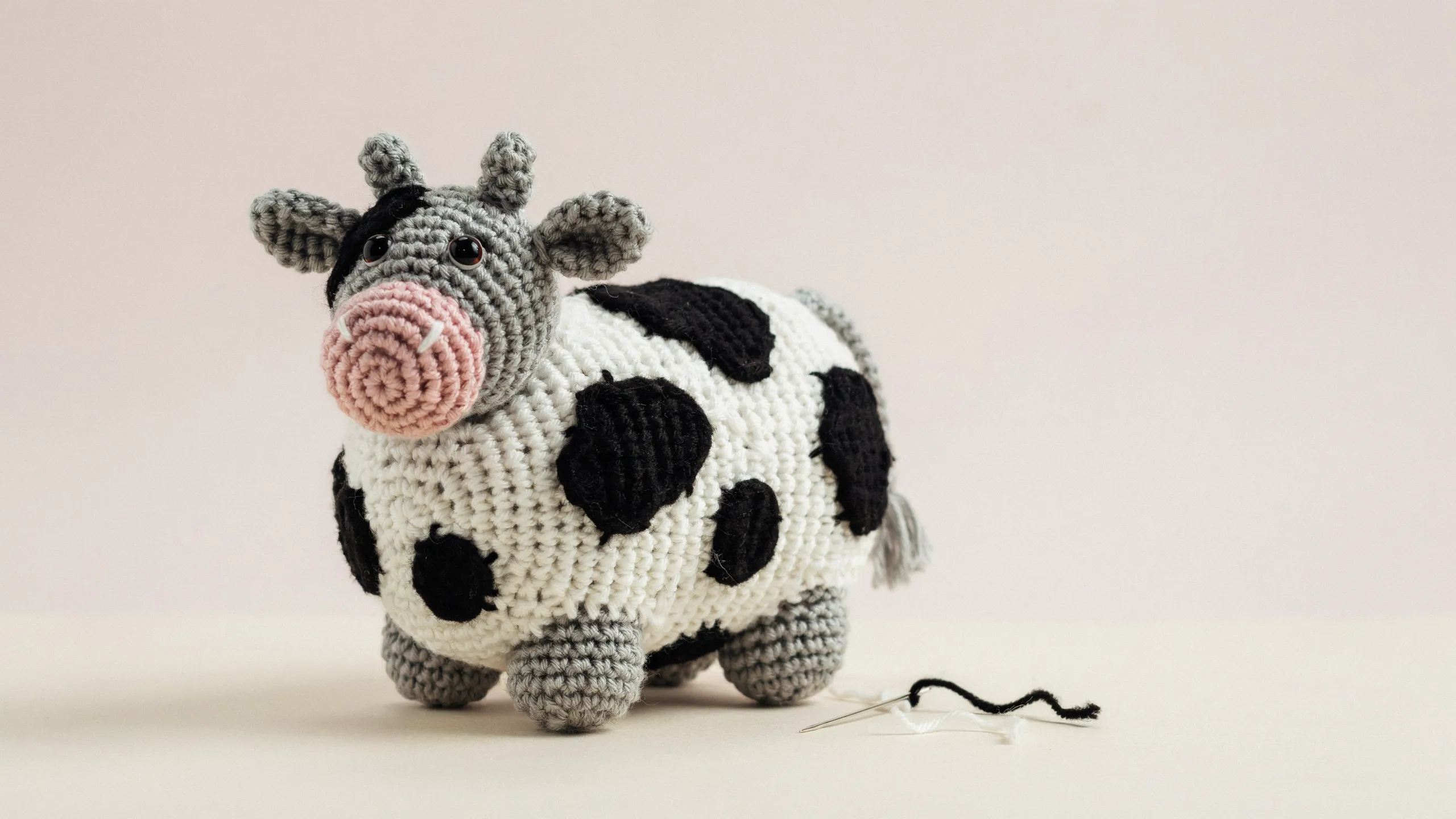 Round crochet cow with patch pattern and flat snout