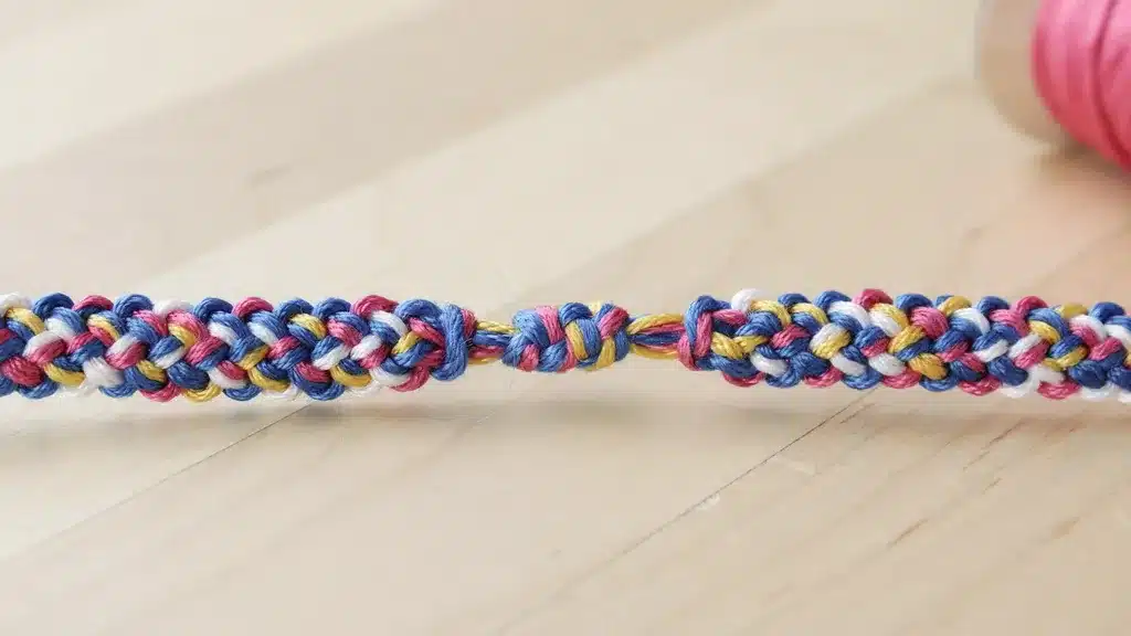 Friendship bracelet with a sliding knot closure, allowing easy size adjustment and secure wear.