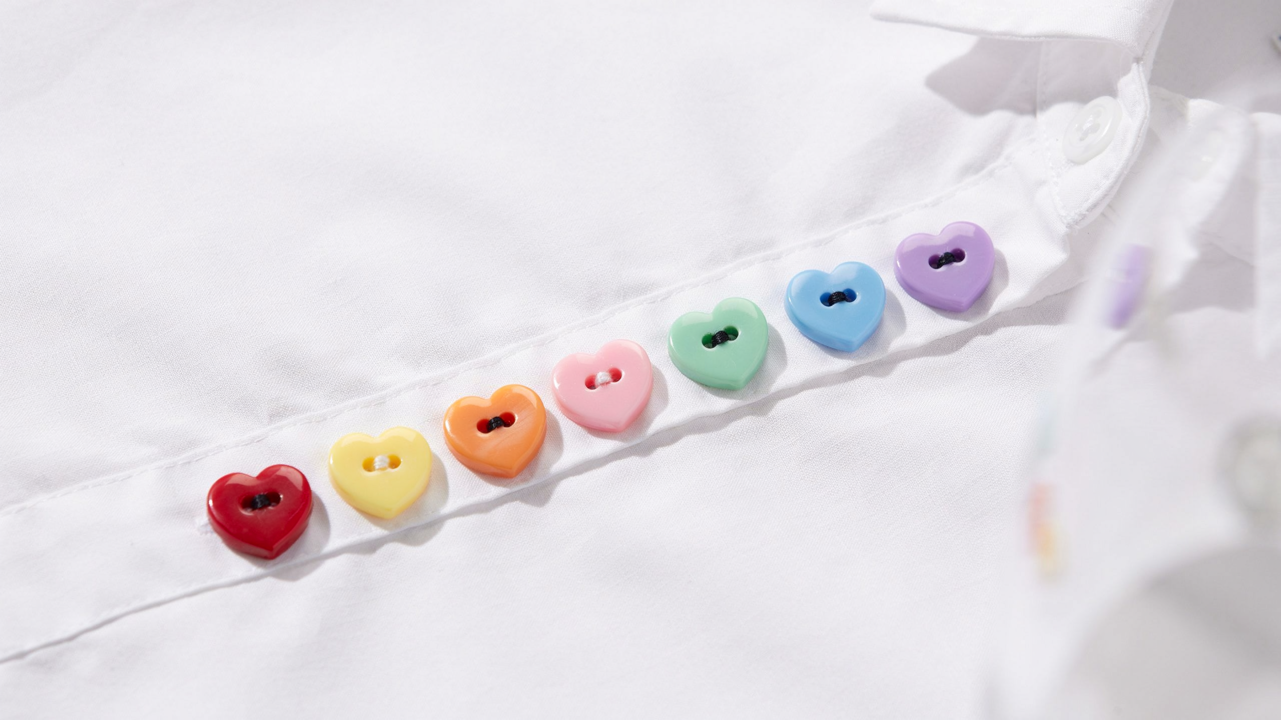 An intricate novelty button shaped like a heart.