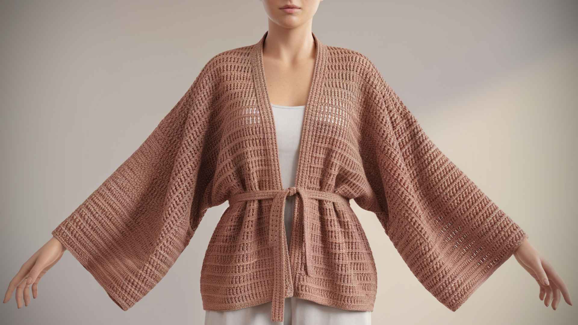 Waist-up model wearing a relaxed kimono-style crochet cardigan.