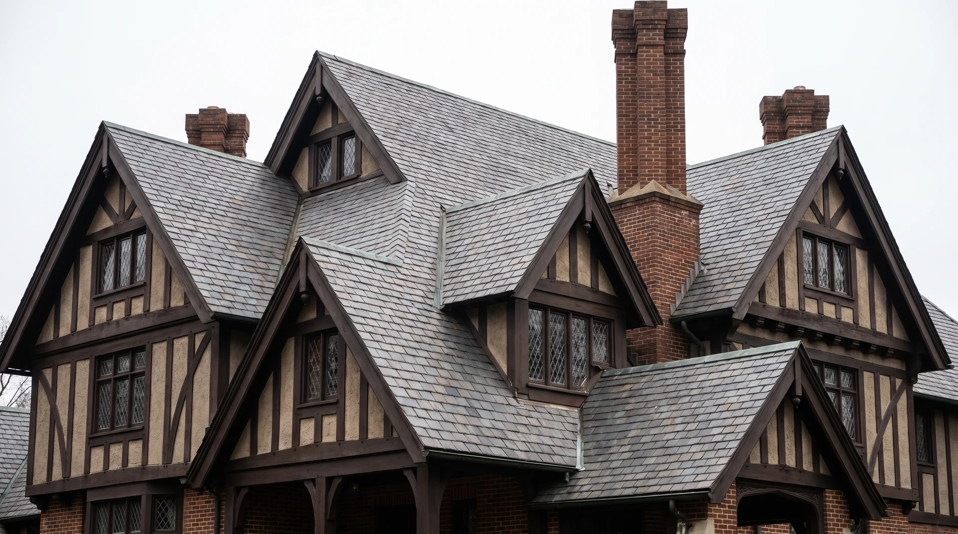 Tudor Revival house with steep roof angles and cross gables