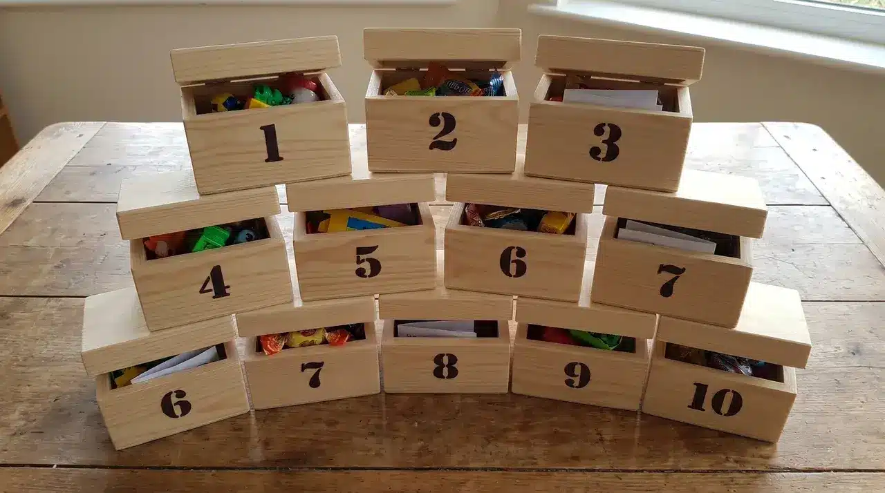 Wooden boxes stacked and numbered with space for advent calendar fillers